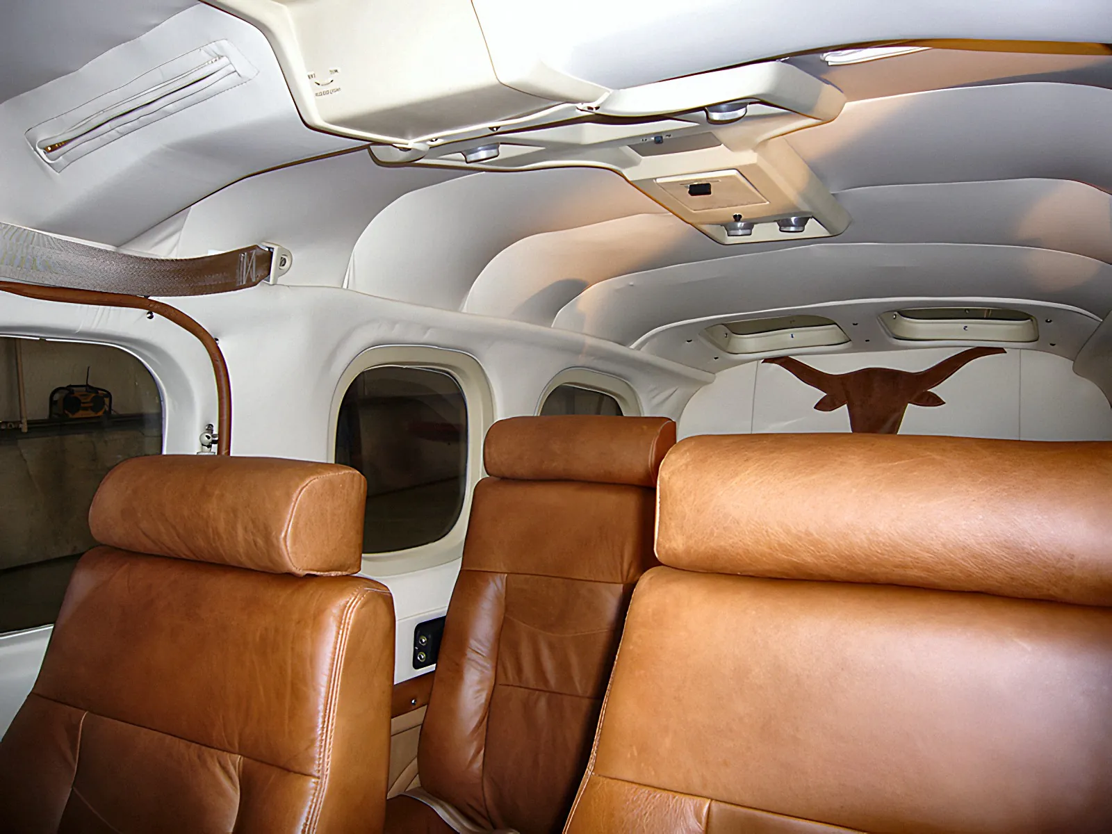 Cessna P210 cabin in cognac leather by D-Tech Aircraft